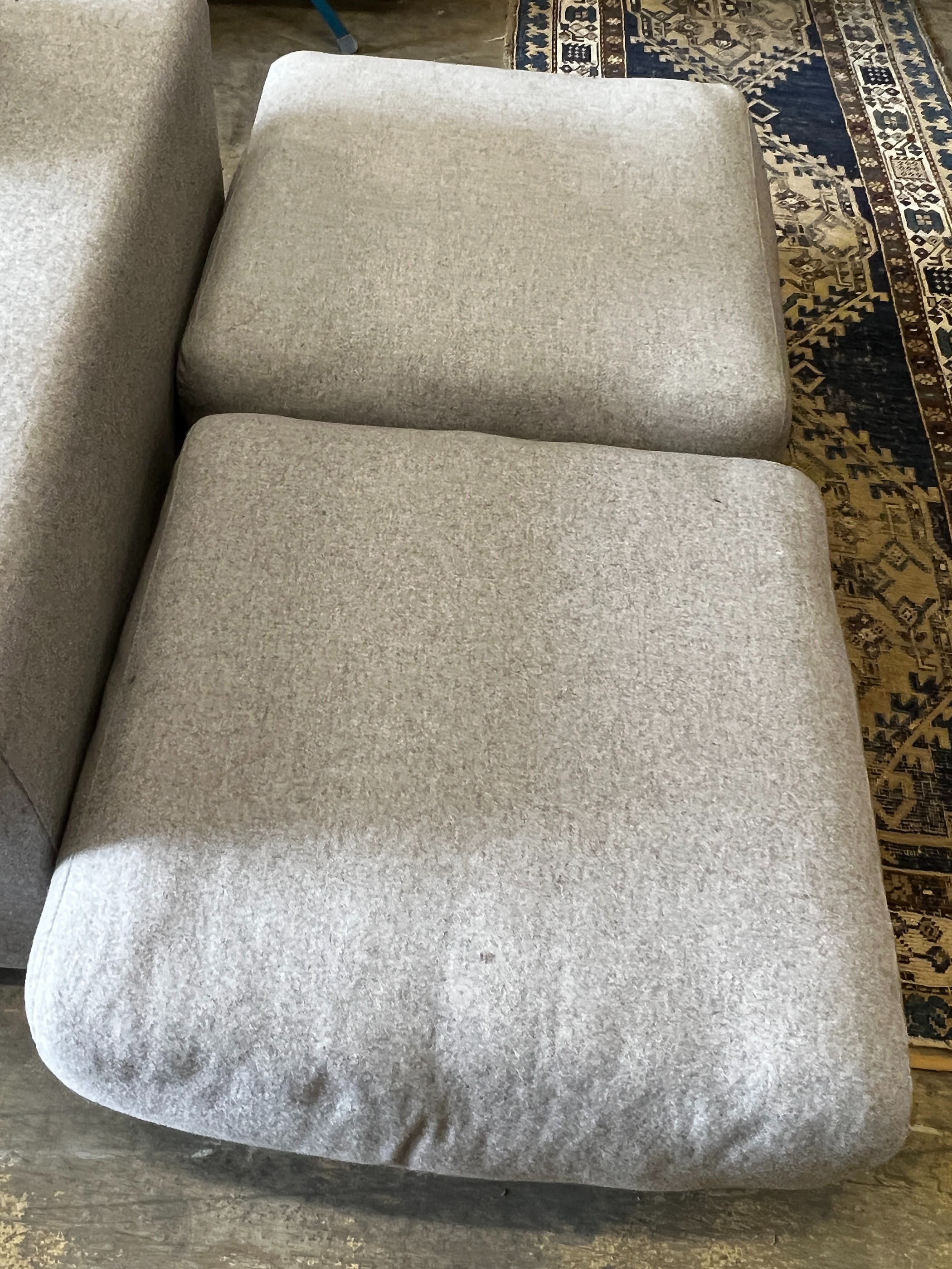 A contemporary Perobell grey fabric sofa, length 235cm, depth 98cm, height 88cm armchair and two foot stools